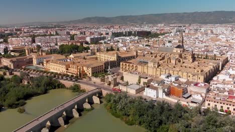 aerial overview of old spanish city with stone bridge