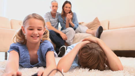 siblings playing games with controllers