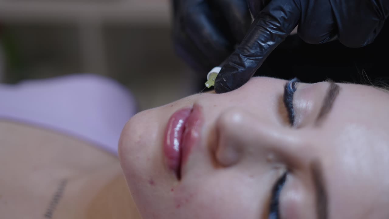 Woman undergoing a beauty or cosmetic treatment on her face