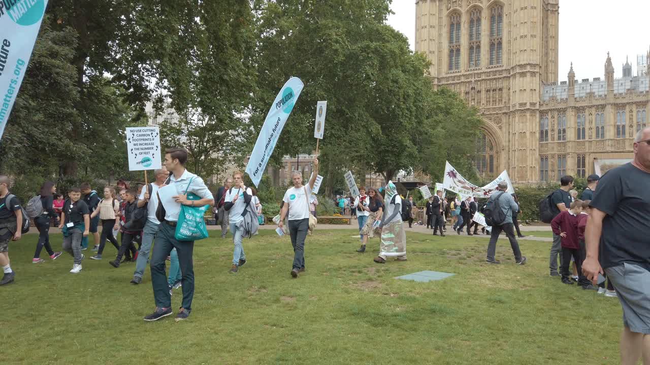 Climate change protestors lobby along the banks of the Thames and outside the houses of Parliament as part of the Time is Now protest