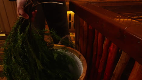 preparing a sauna with fir branches