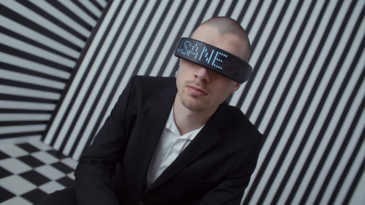 Man wearing VR headset in a black and white optical illusion room