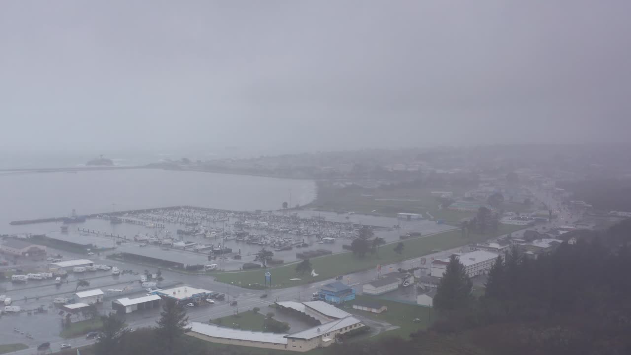 Wide aerial dolly shot of Crescent City during a storm in Northern California. 4K