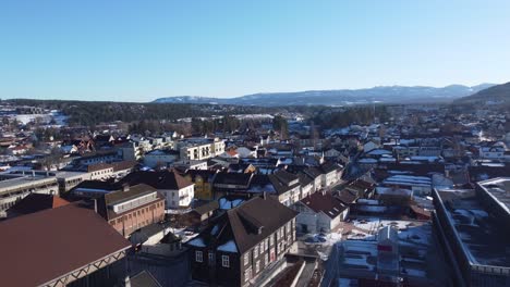 Kongsberg-Norway-during-sunny-winter-day---Low-altitude-aerial-flying-towards-sandsvarsmoen-in-western-part-of-Kongsberg