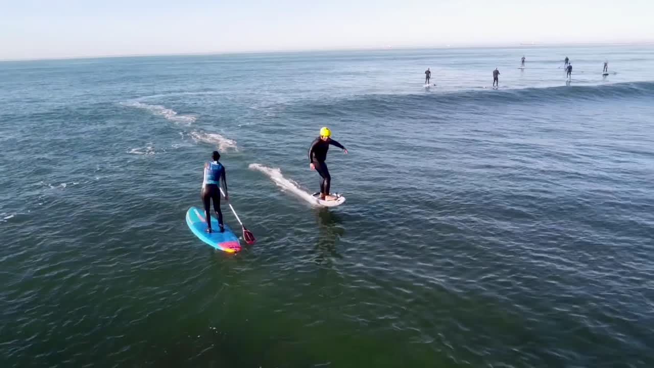 Aerial Wake Surfer Hydrofoil Wakefoil Floating Hovering Over atlantic sea