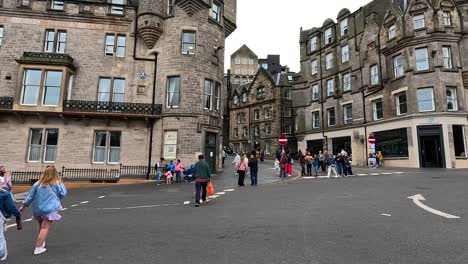 crowd watching a street performer in edinburgh