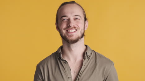 Caucasian-young-man-smiling-at-the-camera.