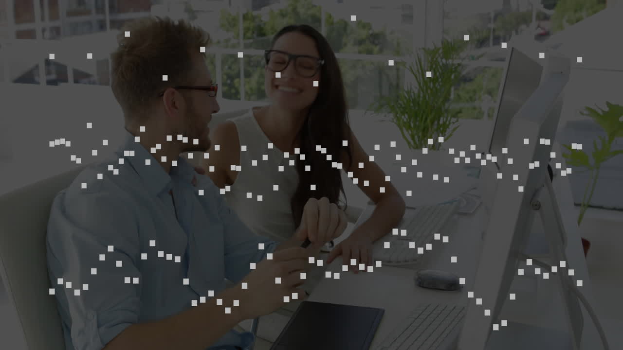 Man working on computer with digital data processing animation overlay