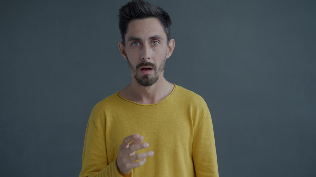 Man Pointing and Talking