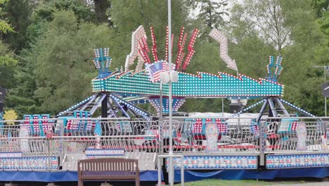 empty fairground ride turning slowly