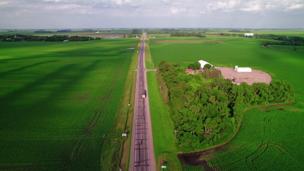 Semi trucks passing on country road in wisconsin, USA