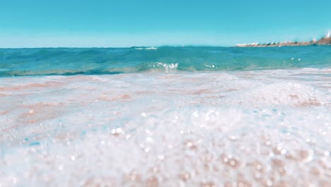 beautiful blue waves hit the camera