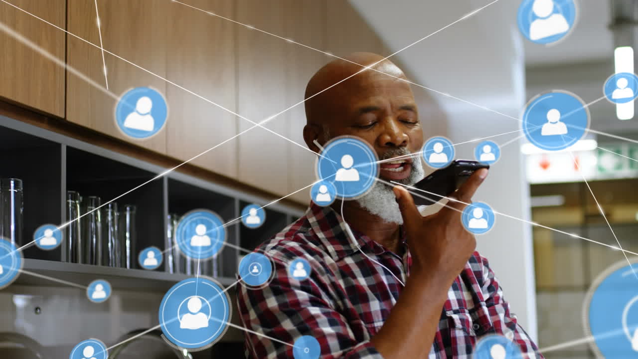 Animation of network of connections with icons over businessman using smartphone