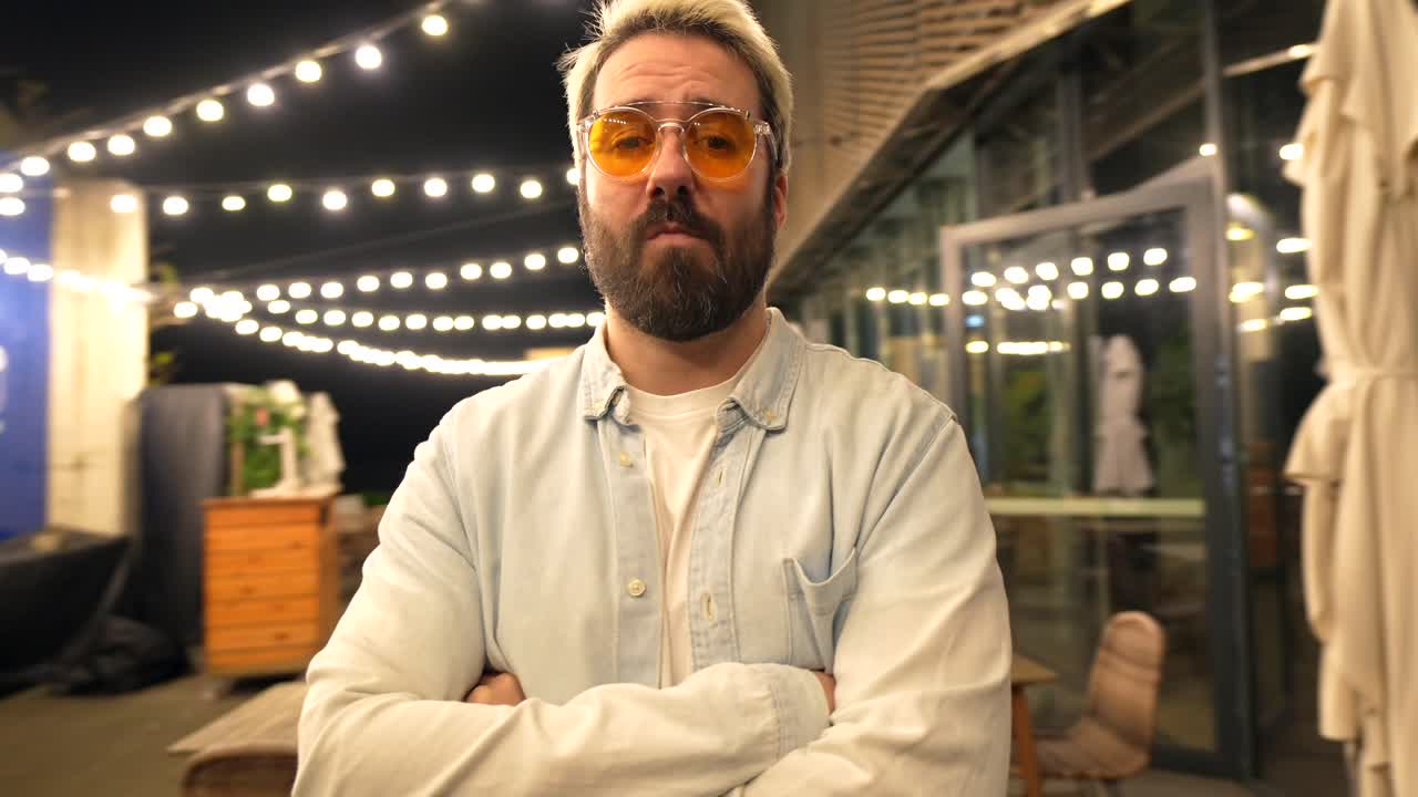 Man with Beard and Sunglasses in Outdoor Setting