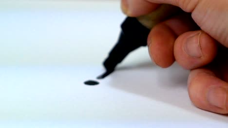 close up of a hand drawing a strategy scheme on a white paper