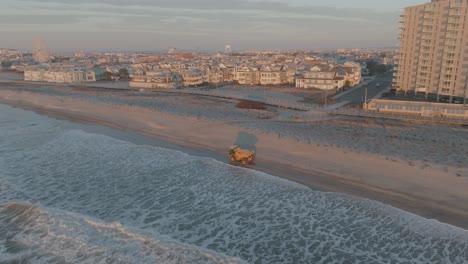 a dump truck is driving on the beach, aerial, panorama view in ocean city