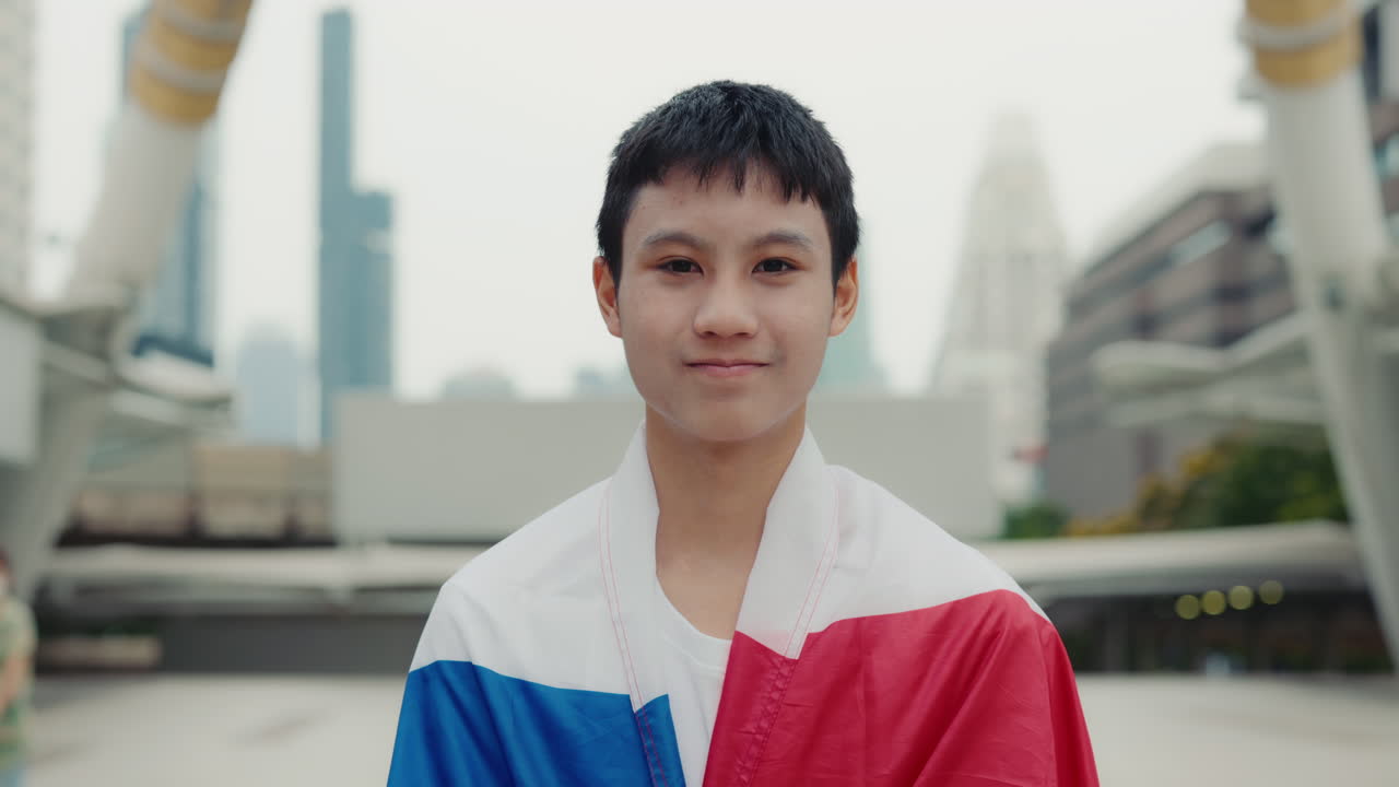 A boy with the Thai flag