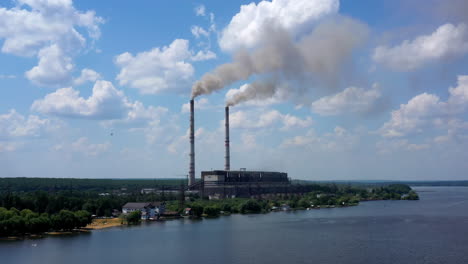 smoking pipes of factory. air pollution by smoke coming out of two factory chimneys