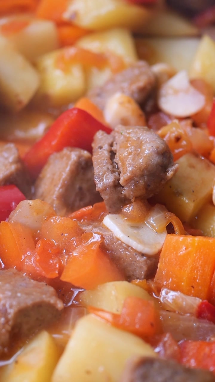 Hearty Stew Simmering with Meat, Potatoes, and Vegetables