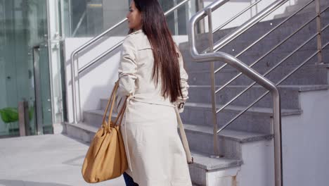 elegant woman walking through town