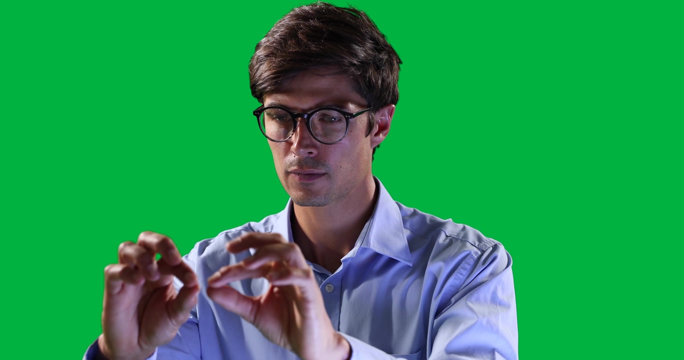 Man Interacting with Virtual Interface on Green Screen