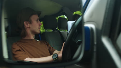 driver writing inside the van