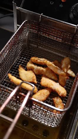 crispy fried fish in a deep fryer