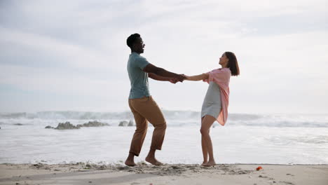 interracial couple enjoying a romantic moment on the beach