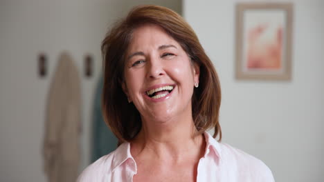 senior woman smiling during festive holiday at home with family