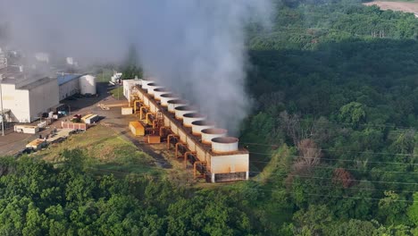 aerial view of steam emitting from a cogen power plant