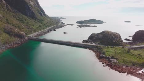 Forward-drone-shot-over-the-sea-with-rocky-cliffs-on-the-side