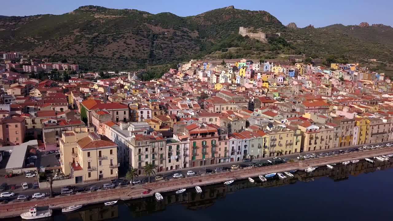 Bosa,Sardinia, Italy - Drone aerial shot of the colourful town of Bosa in Sardinia.Bank turn right over the river temo with awesome green landscape