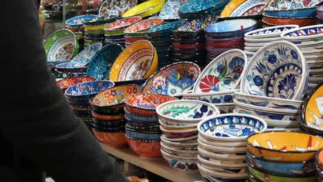 Mid-Shot-of-Man-Looking-at-Bowls