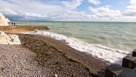 waves hitting the pebbled shore in brighton