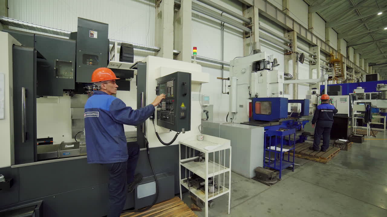 Factory Workers Operating Machinery
