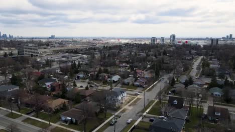 aerial shot circling over grey, winter neighborhood in toronto