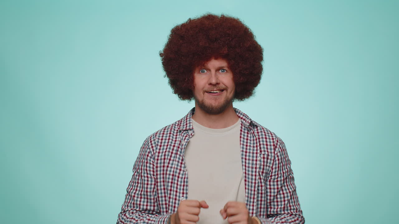 Photographer man gesturing picture frame with hands imitating zoom and cropping nice image photo