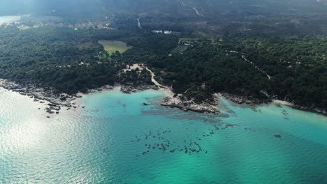 Aerial-view-of-the-famous-Kavourotripes-and-Portokali-beach-in-Sithonia,-Chalkidiki,-Greece