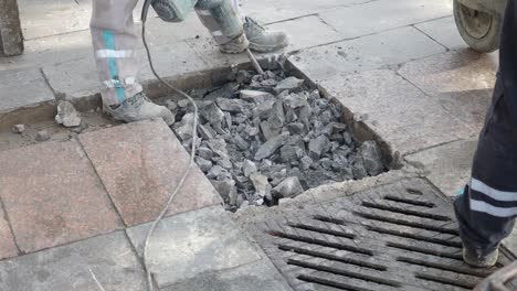 construction workers repairing the sidewalk