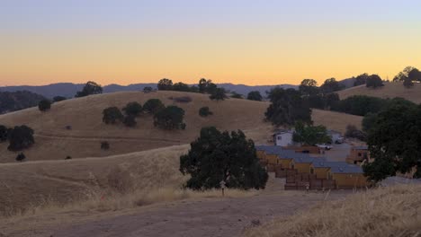 cozy cabins nestled between gently rolling hills. the serene natural landscape evokes a sense of calm and seclusion, ideal for depicting travel, relaxation, or countryside retreats