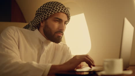 Focused man typing laptop closeup. Successful professional considering problem
