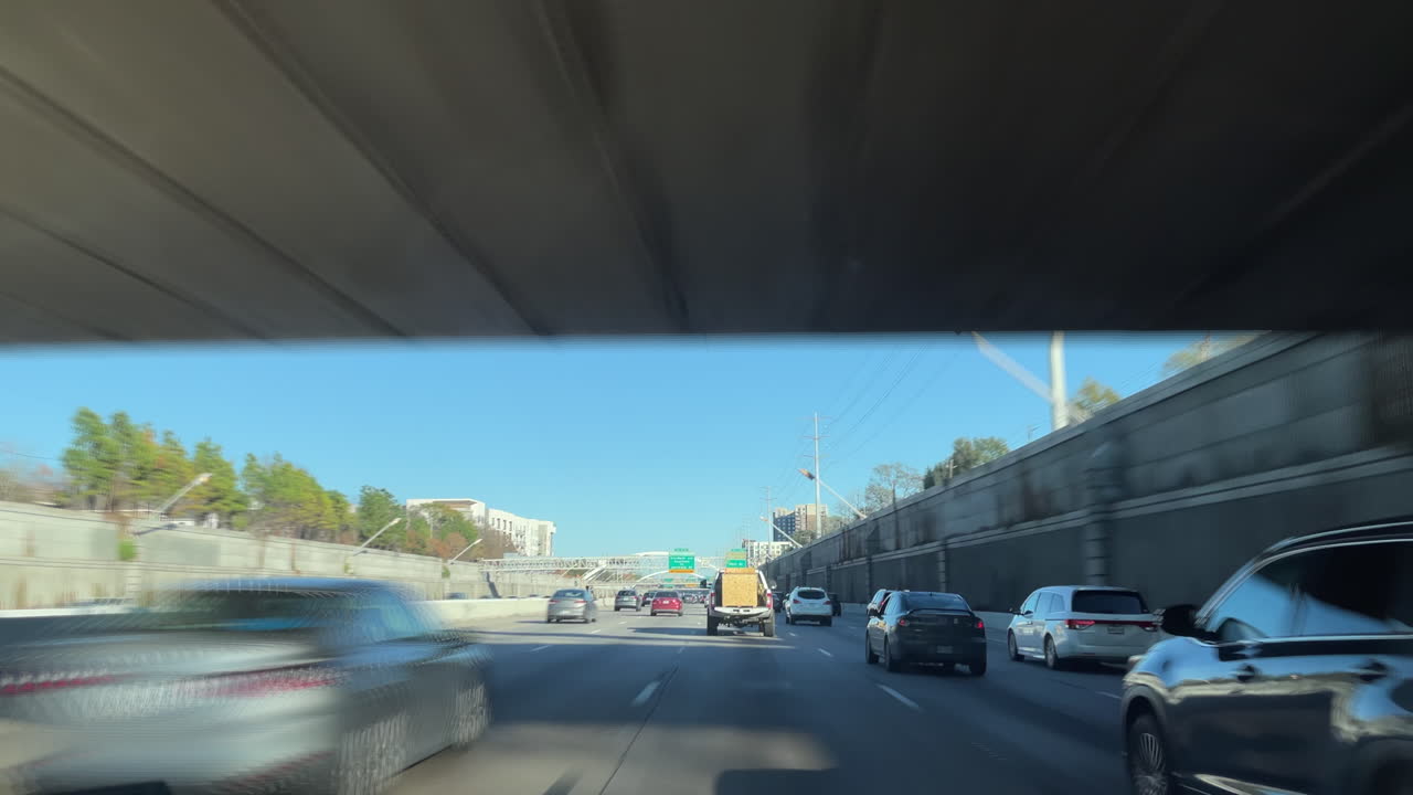 Timelapse traffic at rush hour on Houston Texas Freeway I69. Highway Texas 59 driving time-lapse during the busy time. Driving on the freeway through bridges fast forward through time in traffic jam