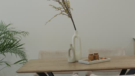 stylish dining table decor with vase and flowers