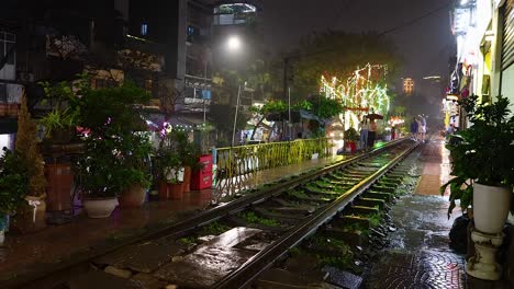 rainy night scene with illuminated railway