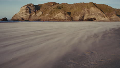 windswept beach with rocky coastline