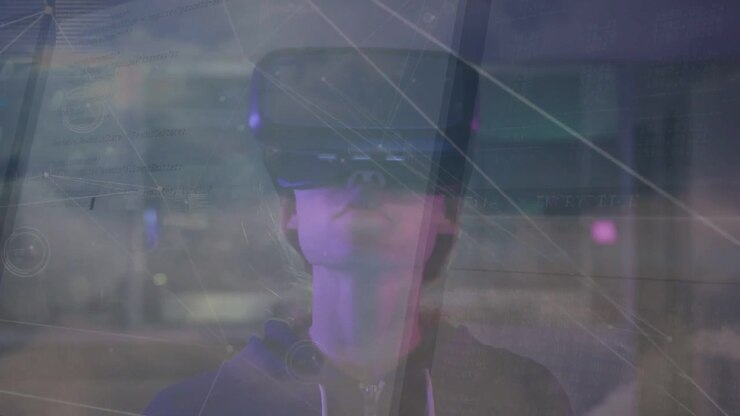 Adult female wearing VR headset and dark hoodie turning head upward at workspace with HUD overlays
