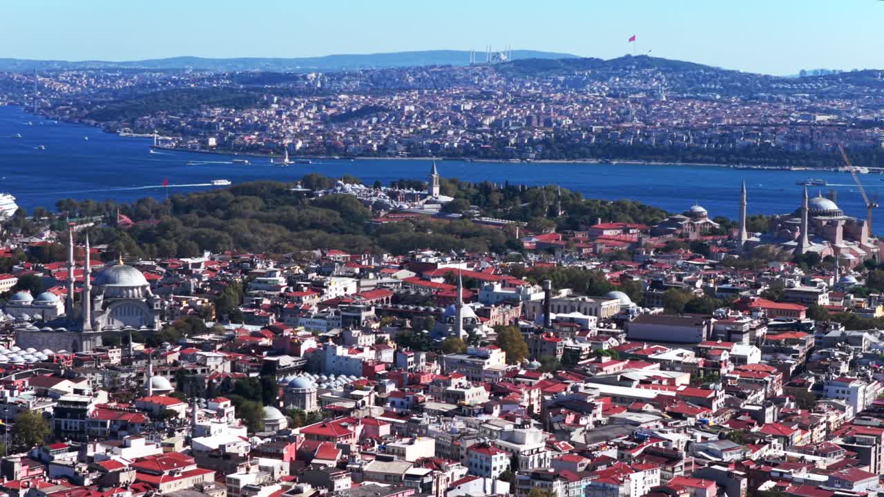 Morning Istanbul Turkey Türkiye aerial drone the Golden Horn Blue Mosque temple Hagia Sophia Grand Mosque cityscape Bosphorus Strait river ferries boats harbor view blue sky backwards motion