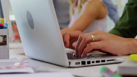 Close-up-of-executive-using-laptop-at-desk-4k