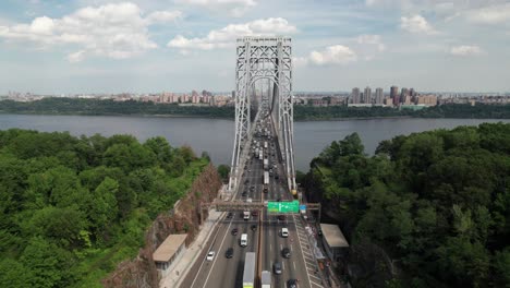 side-panning shot of highway traffic entering new york city, 4k