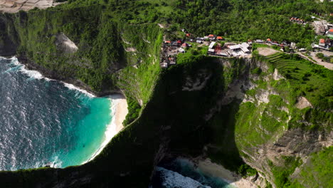 establishing aerial pullback of nusa penida with kelingking and embon beach coves